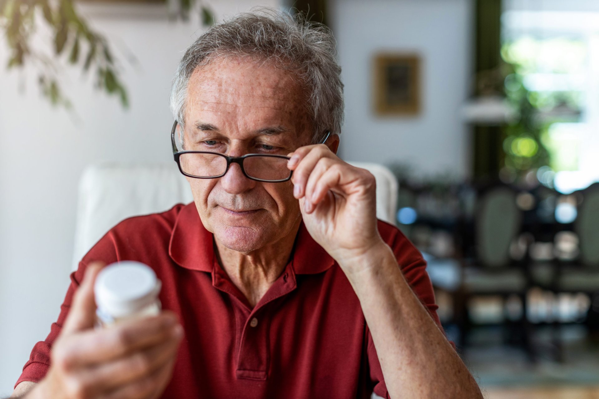 Man reading a prescription drug label