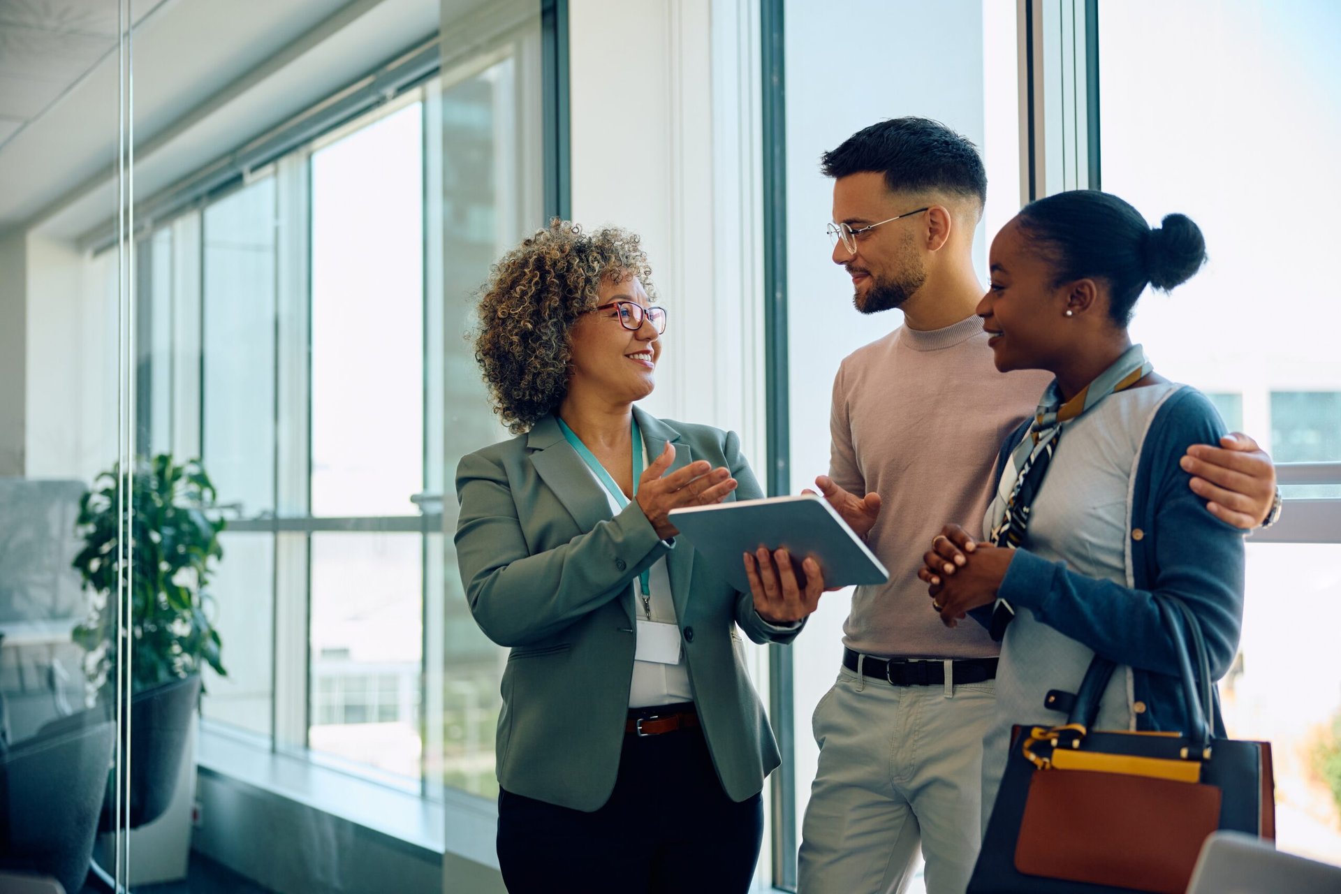 Financial advisor speaking with investment clients at a business meeting for financial advice