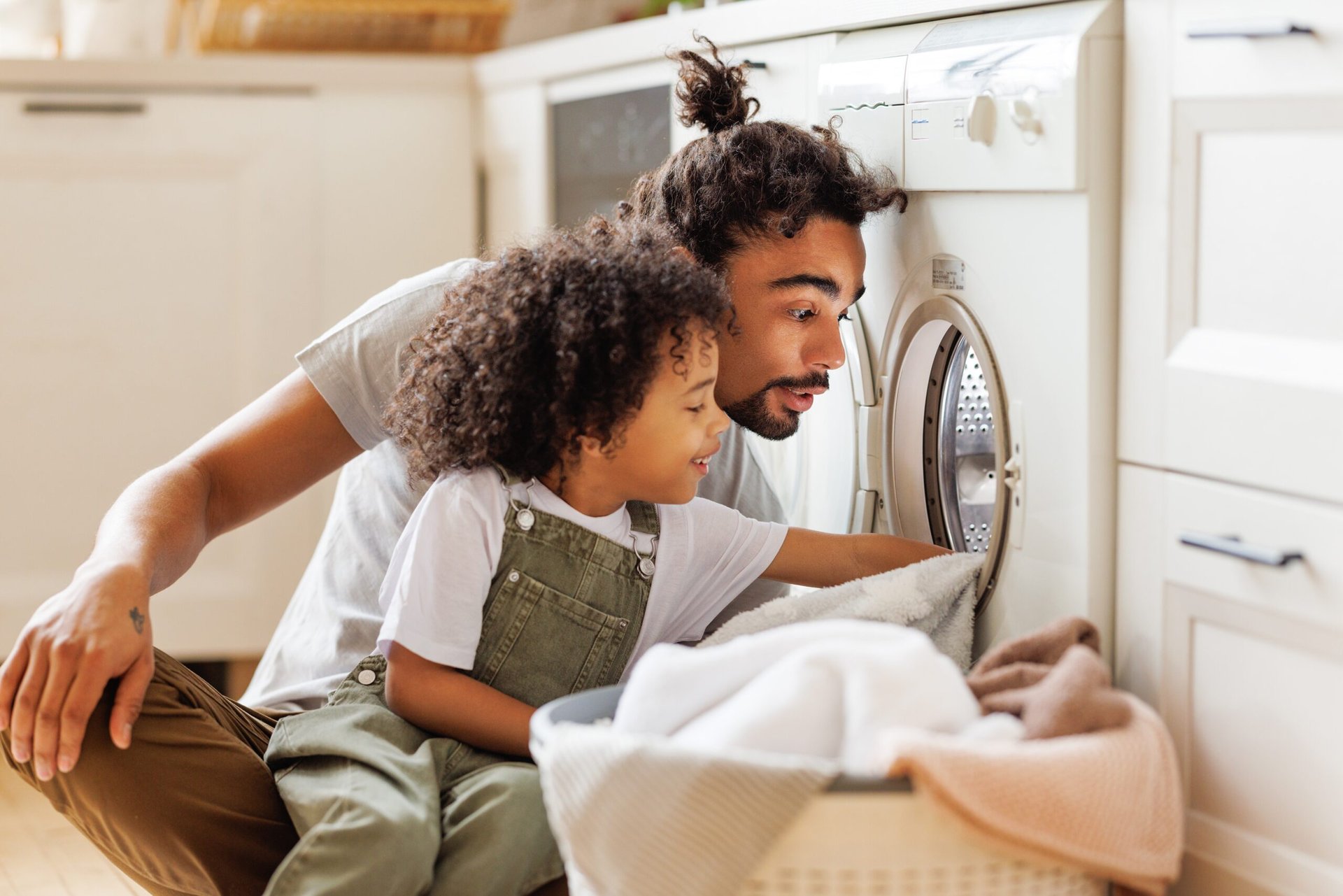 Father and son doing laundry