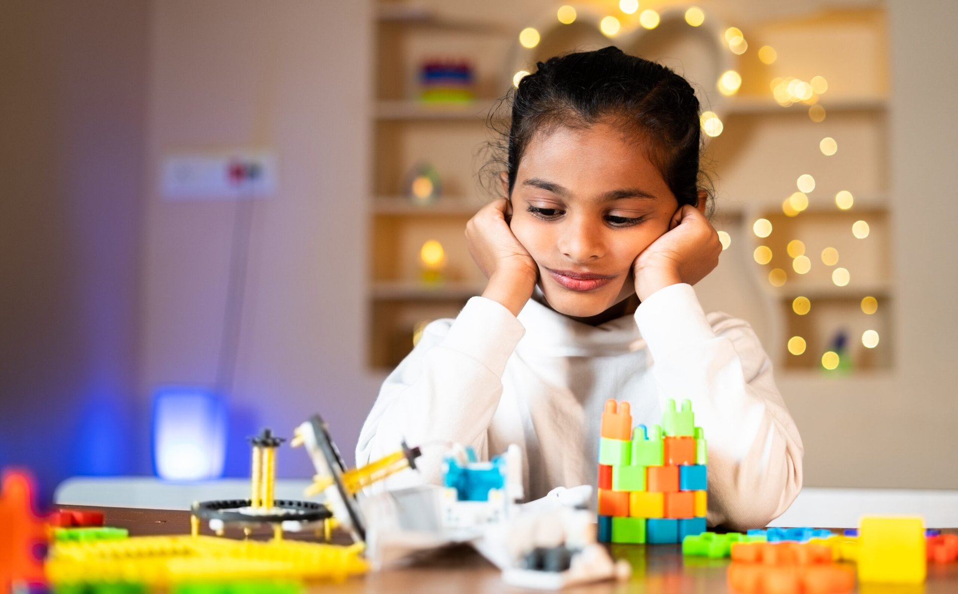 child with broken toys