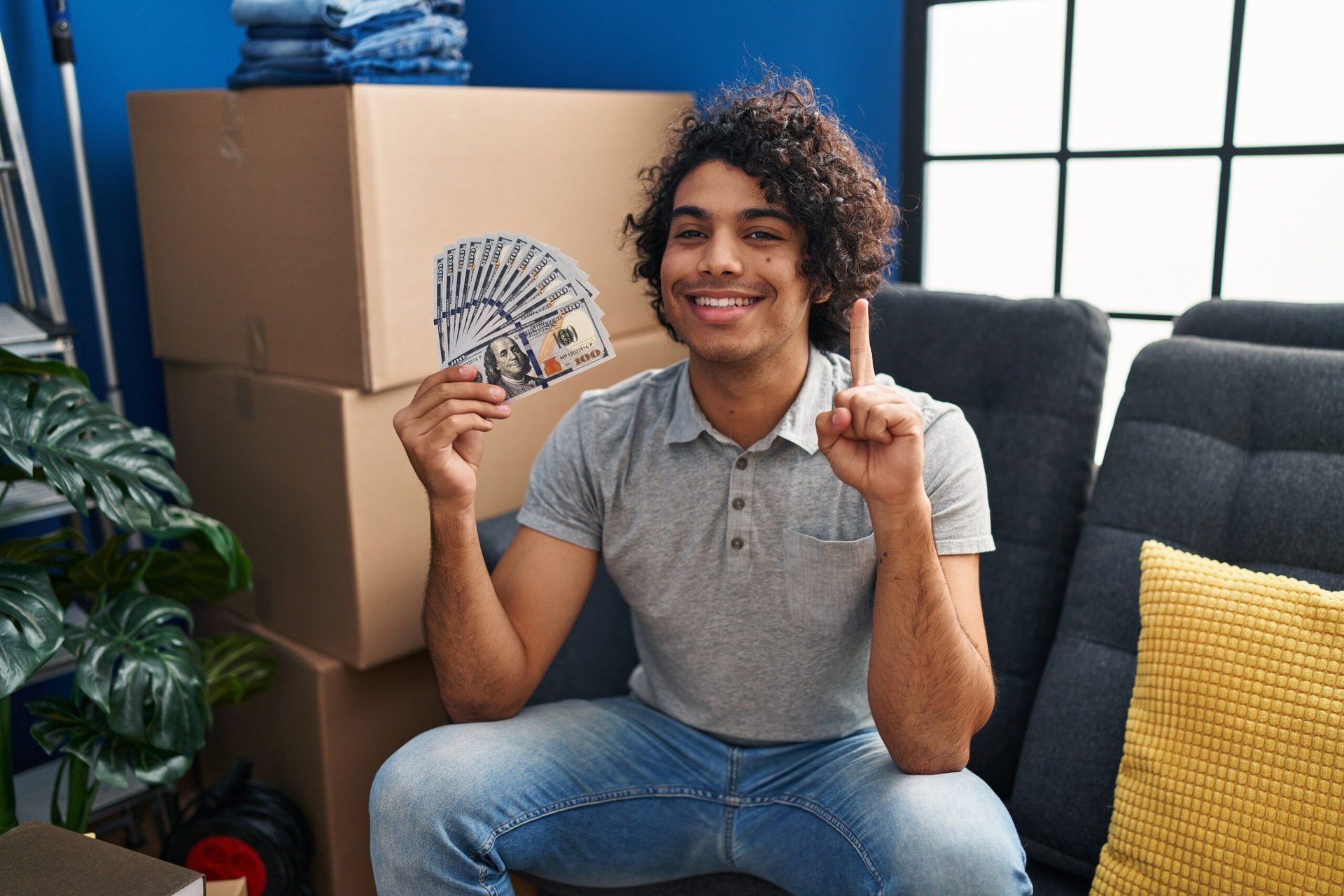 Young man holding cash