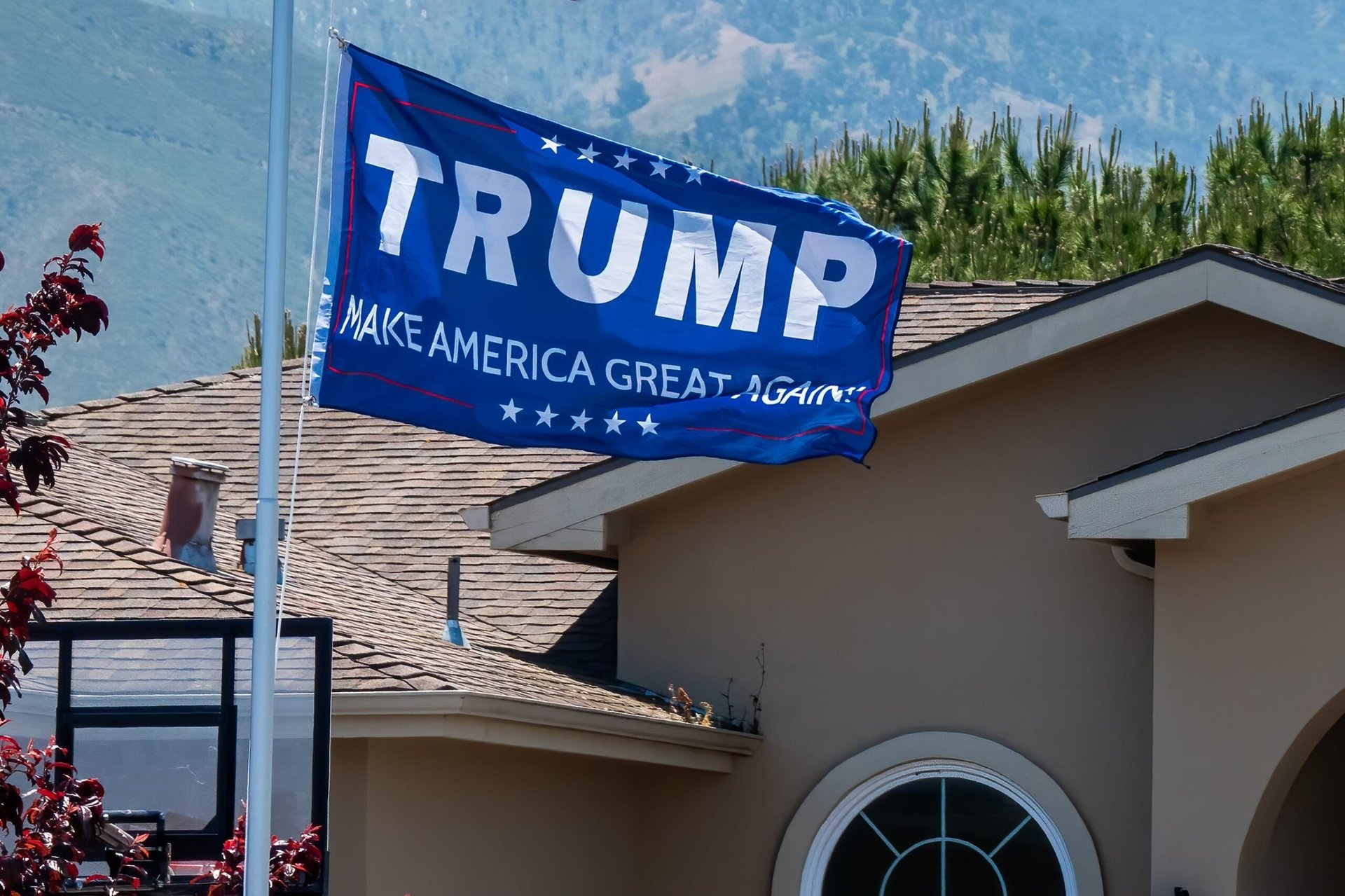 House with a Trump MAGA flag in front