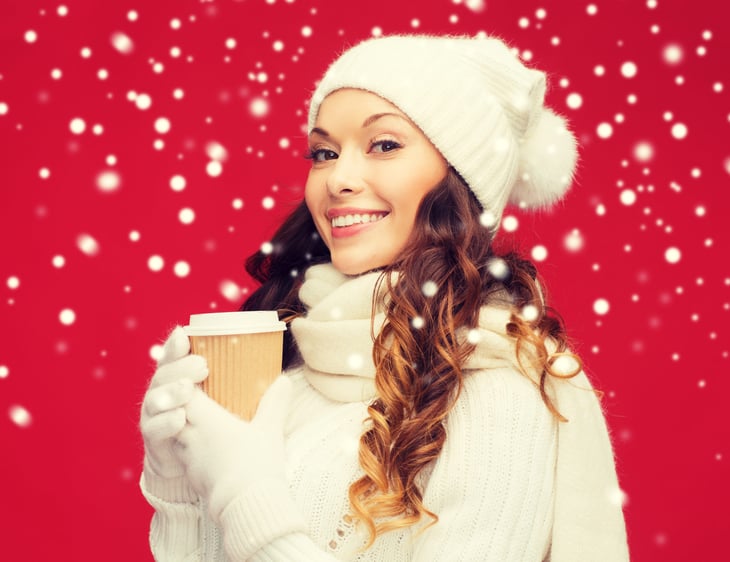 Woman in winter drinking coffee