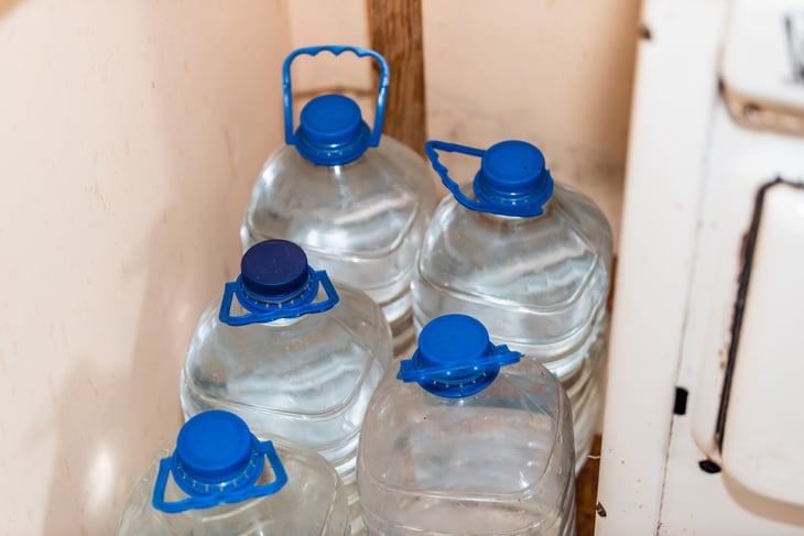 plastic gallon jugs filled with water
