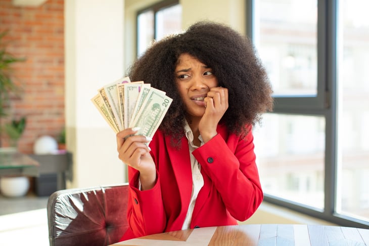 Woman worried about money and paying bills